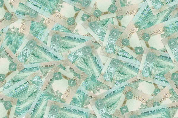 10 tane BAE kara para yığını var. Zengin yaşam kavramsal geçmişi. Büyük miktarda para.