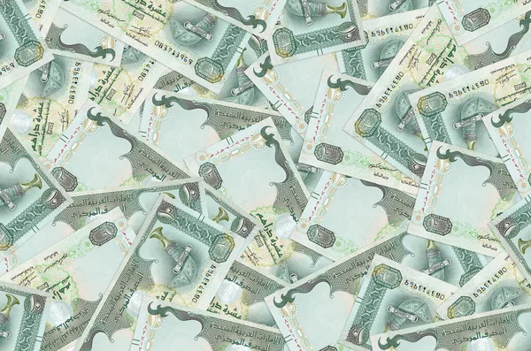 10 UAE dirhams bills lies in big pile. Rich life conceptual background. Big amount of money