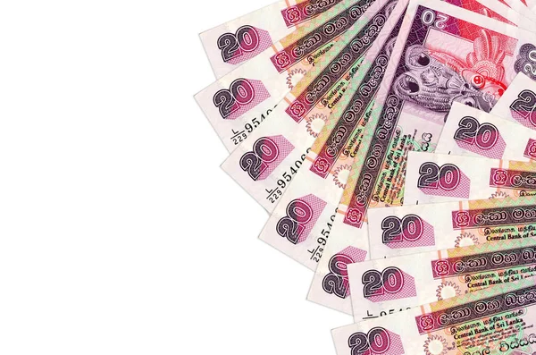 20 Sri Lanka Rupisi banknotları beyaz arka planda fotokopi alanı ile izole bir şekilde duruyor. Zengin yaşam kavramsal geçmişi. Büyük miktarda ulusal para birimi zenginliği