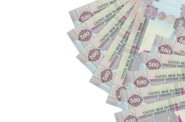 500 BAE dirhem banknotu beyaz arka planda fotokopi alanı ile izole bir şekilde duruyor. Zengin yaşam kavramsal geçmişi. Büyük miktarda ulusal para birimi zenginliği