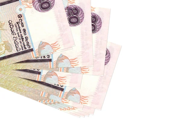 20 Sri Lanka rupisi küçük gruplar halinde ya da beyaz paketler halinde yatar. Kopyalama alanı olan bir model. İş ve para değişimi kavramı