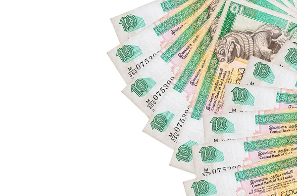 10 Sri Lanka Rupisi banknotları beyaz arka planda fotokopi alanı ile izole bir şekilde duruyor. Zengin yaşam kavramsal geçmişi. Büyük miktarda ulusal para birimi zenginliği
