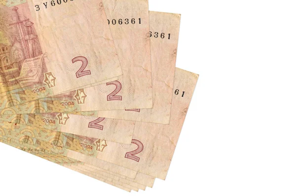 2 Ukrayna hrivniası banknotları küçük gruplar halinde yatar ya da beyazın üzerine izole edilmiş paketler halinde. Kopyalama alanı olan bir model. İş ve para değişimi kavramı