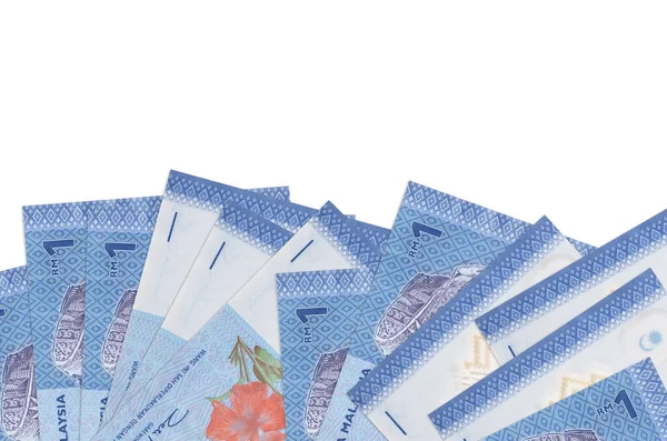 1 Malezya ringgit banknotları beyaz zemin üzerinde izole edilmiş ve kopyalama alanı olan ekranın alt tarafında yatmaktadır. Paralı iş kavramları için arkaplan afişi şablonu