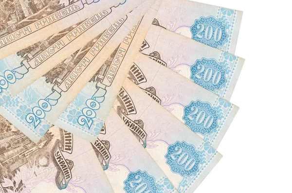200 Ukrayna hrivniası banknotları beyaz arka planda izole edilmiş, fotokopi alanı da yakın planda tutuluyor. Finansal işlemler kavramı