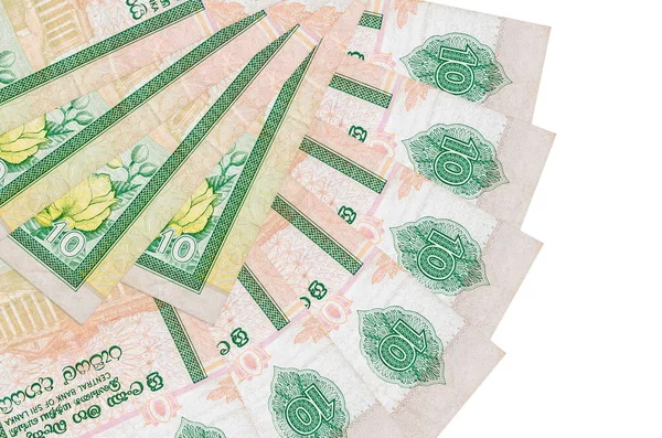 10 Sri Lanka Rupisi banknotları beyaz arka planda izole edilmiş, fotokopi alanı da yakın planda. Finansal işlemler kavramı