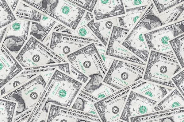 1 dolarlık banknotlar büyük yığının içinde yatıyor. Zengin yaşam kavramsal geçmişi. Büyük miktarda para.