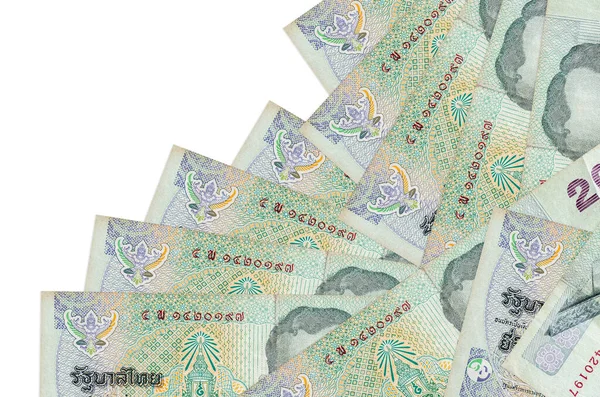 20 Tayland Baht banknotu beyaza izole edilmiş farklı bir sırayla yatar. Yerel bankacılık ya da para kazanma konsepti. İş arkaplanı afişi