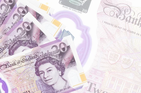 20 İngiliz sterlinli banknotlar büyük yarı şeffaf banknotların arkasında duruyor. Kopyalama alanı olan soyut iş arkaplanı
