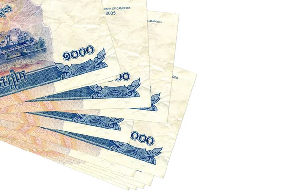 1000 Kamboçyalı isyan senedi küçük gruplar halinde ya da beyazlar üzerinde izole edilmiş paketler halinde duruyor. Kopyalama alanı olan bir model. İş ve para değişimi kavramı