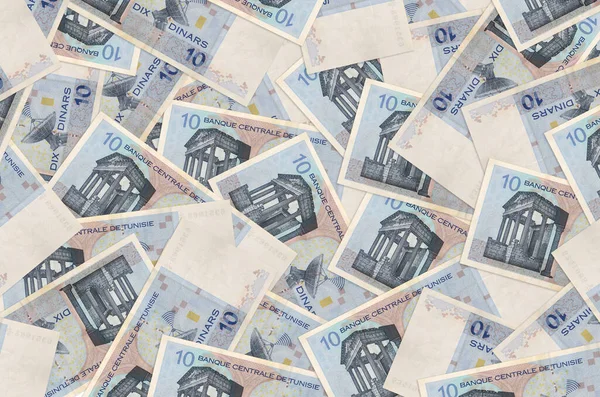 10 Tunisian dinars bills lies in big pile. Rich life conceptual background. Big amount of money