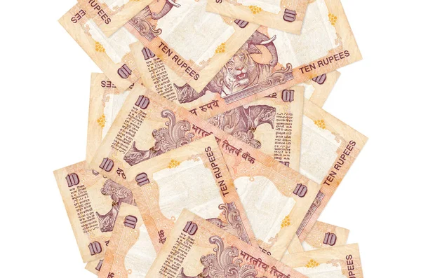 10 Hint rupi banknotları beyazın üzerinde izole bir şekilde uçuyor. Birçok banknot sol ve sağ tarafta beyaz kopya alanı ile düşüyor