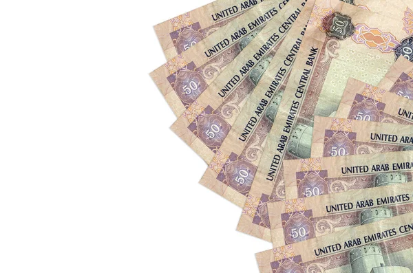 50 BAE dirhem banknotu beyaz arka planda fotokopi alanı ile izole bir şekilde duruyor. Zengin yaşam kavramsal geçmişi. Büyük miktarda ulusal para birimi zenginliği