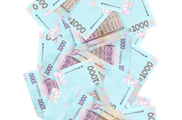 Beyaz üzerinde izole edilmiş 1000 tane Ukrayna hrivniası banknotu. Birçok banknot sol ve sağ tarafta beyaz kopya alanı ile düşüyor