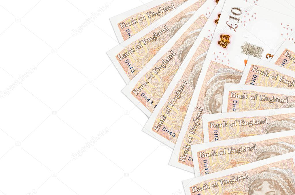 10 British pounds bills lies isolated on white background with copy space. Rich life conceptual background. Big amount of national currency wealth