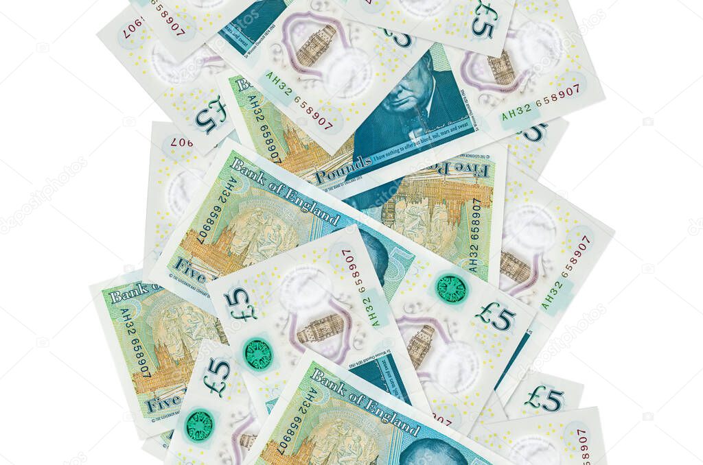 5 British pounds bills flying down isolated on white. Many banknotes falling with white copy space on left and right side