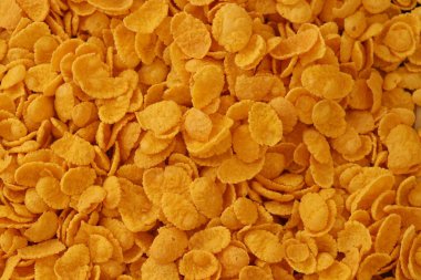 Mısır gevreği arkaplanı ve dokuyu kapatır. Sabah kahvaltısı için mısır gevreği kutusu.