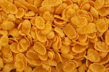 Mısır gevreği arkaplanı ve dokuyu kapatır. Sabah kahvaltısı için mısır gevreği kutusu.