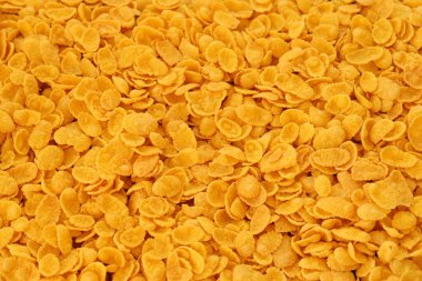 Mısır gevreği arkaplanı ve dokuyu kapatır. Sabah kahvaltısı için mısır gevreği kutusu.