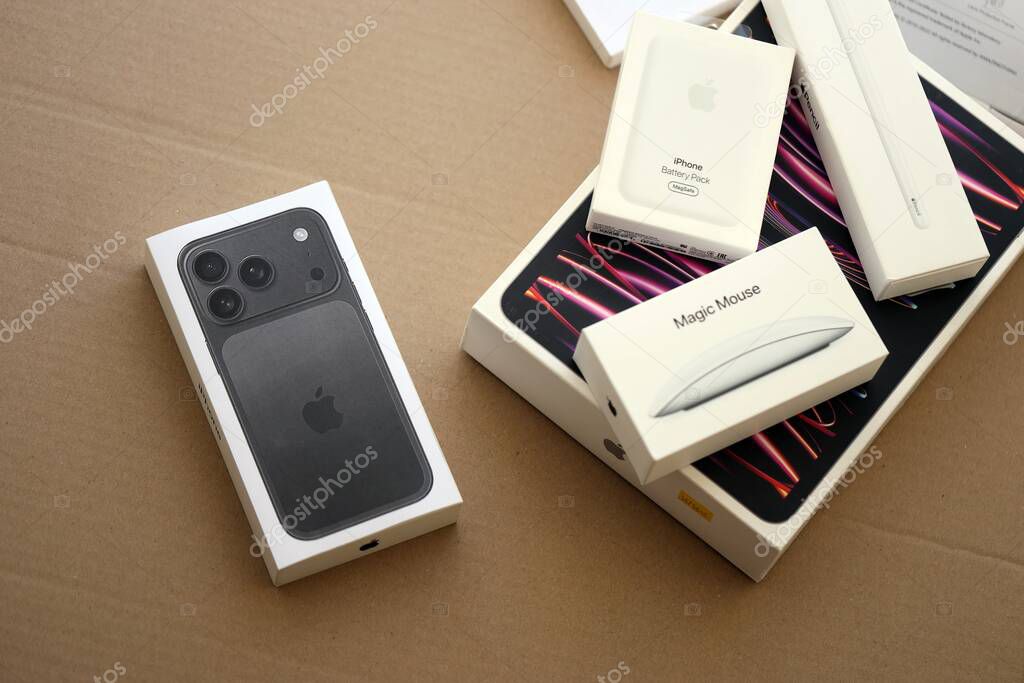 KYIV, UKRAINE - SEPTEMBER 21, 2025 Apple iPhone 17 Pro Max Black box and other apple products on cardboard surface close up