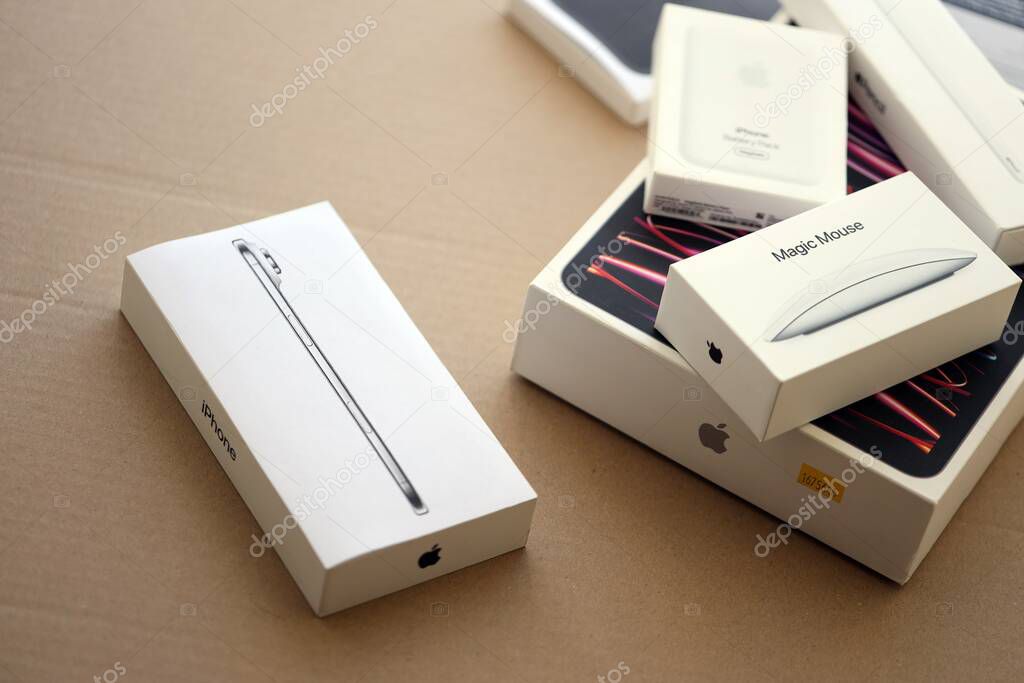 KYIV, UKRAINE - SEPTEMBER 21, 2025 Apple iPhone 17 Slim box and other apple products on cardboard surface close up
