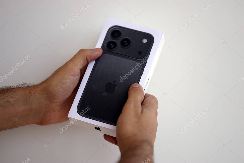 KYIV, UKRAINE - SEPTEMBER 21, 2025 Apple iPhone 17 Pro Max Black box in male hands in shop close up