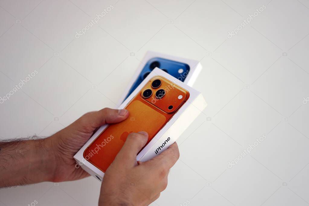 KYIV, UKRAINE - SEPTEMBER 21, 2025 Apple iPhone 17 Pro Max Cosmic Orange box in male hands in shop close up