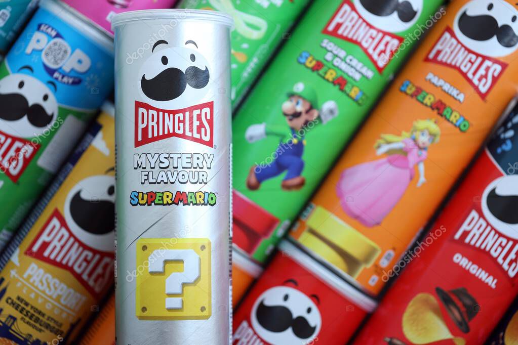 KYIV, UKRAINE - SEPTEMBER 21, 2025 Many pringles tubes of chips with various flavours close up