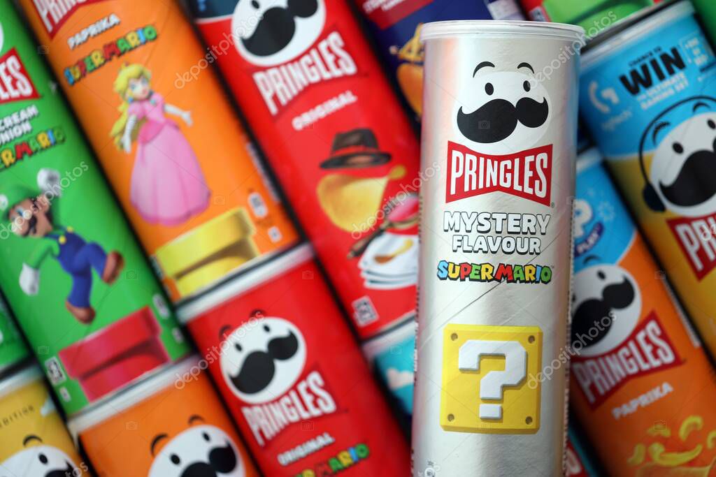 KYIV, UKRAINE - SEPTEMBER 21, 2025 Many pringles tubes of chips with various flavours close up