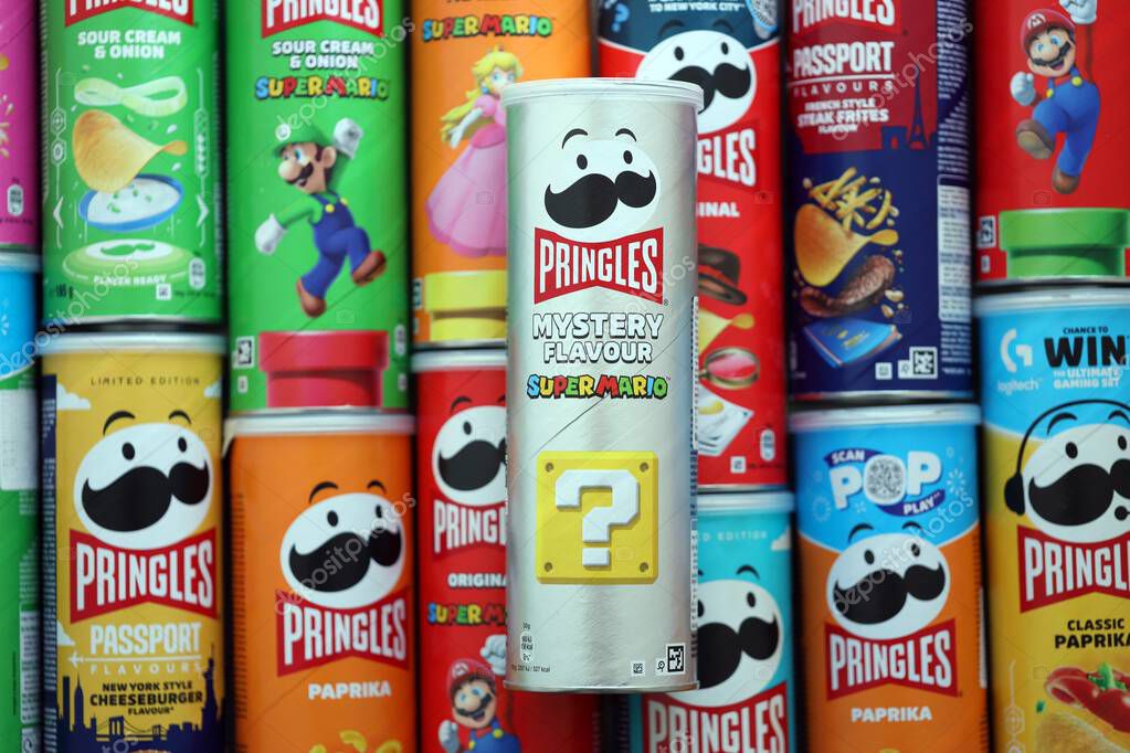 KYIV, UKRAINE - SEPTEMBER 21, 2025 Many pringles tubes of chips with various flavours close up