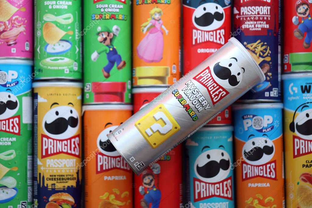 KYIV, UKRAINE - SEPTEMBER 21, 2025 Many pringles tubes of chips with various flavours close up