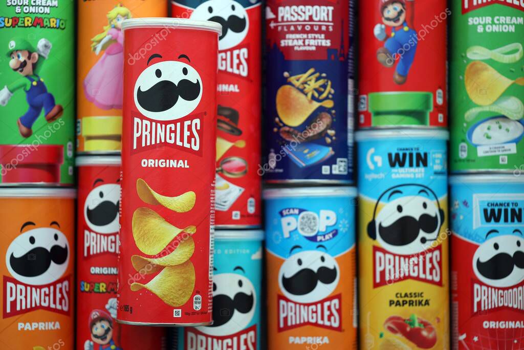 KYIV, UKRAINE - SEPTEMBER 21, 2025 Many pringles tubes of chips with various flavours close up