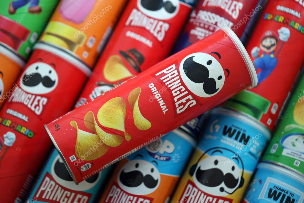KYIV, UKRAINE - SEPTEMBER 21, 2025 Many pringles tubes of chips with various flavours close up