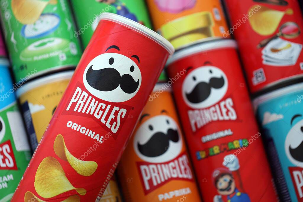 KYIV, UKRAINE - SEPTEMBER 21, 2025 Many pringles tubes of chips with various flavours close up