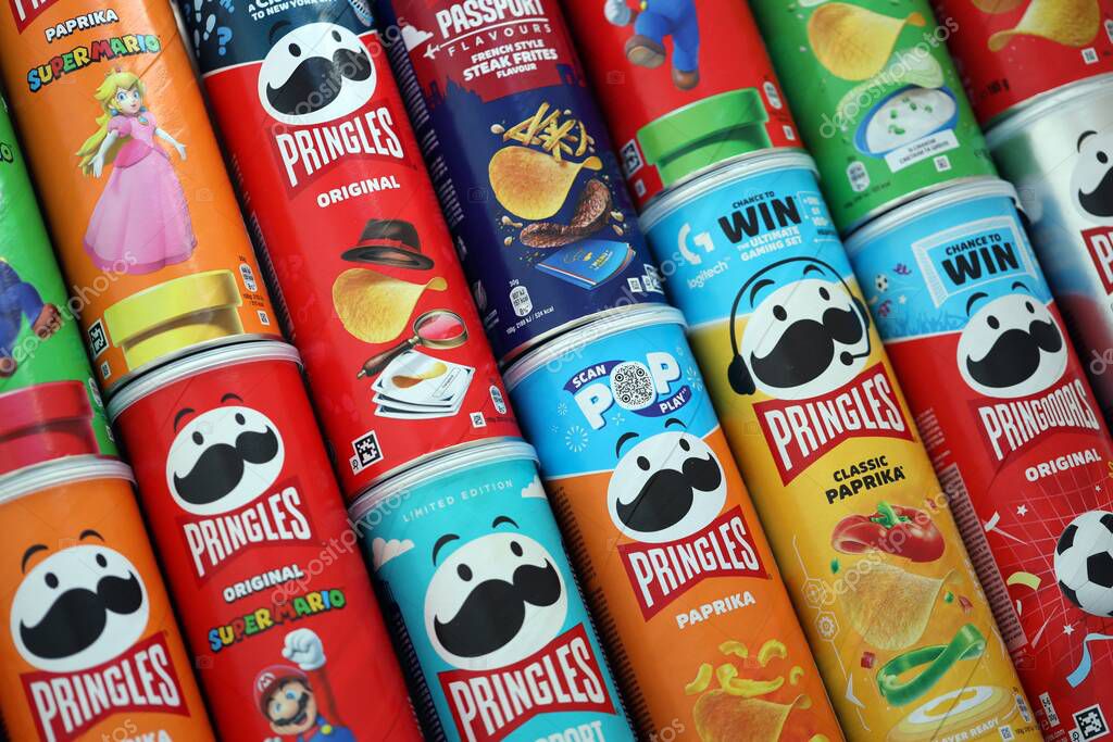KYIV, UKRAINE - SEPTEMBER 21, 2025 Many pringles tubes of chips with various flavours close up