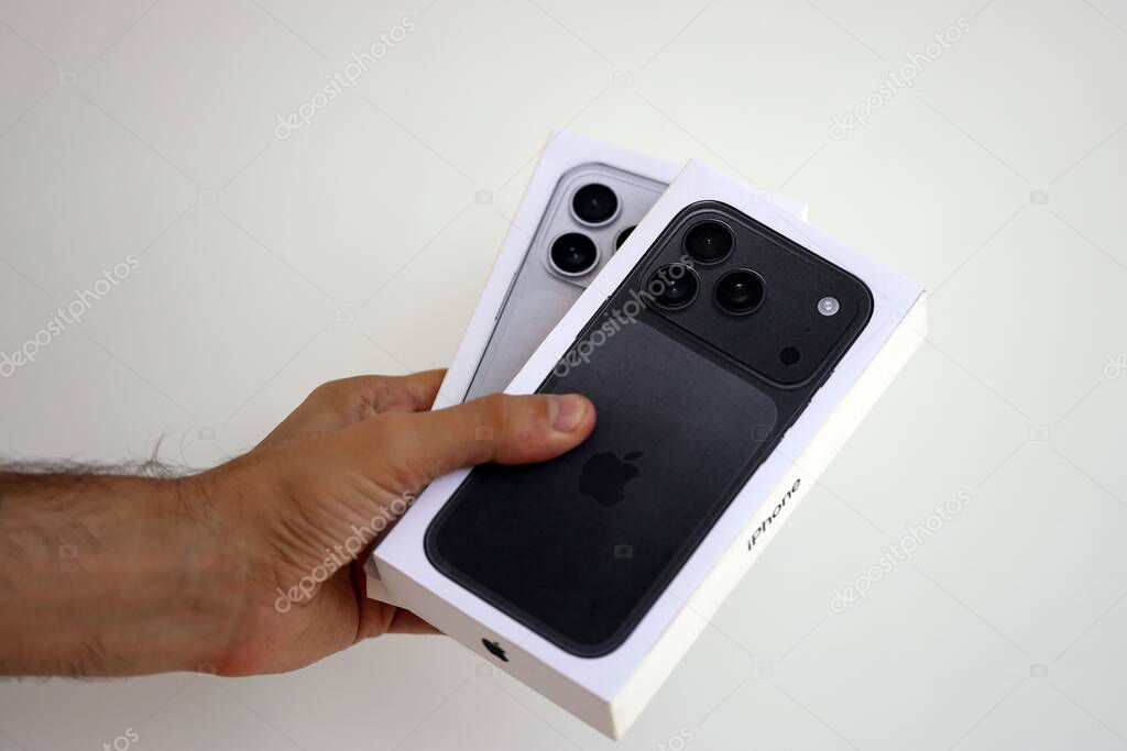 KYIV, UKRAINE - SEPTEMBER 21, 2025 Apple iPhone 17 Pro Max Black box in male hands in shop close up