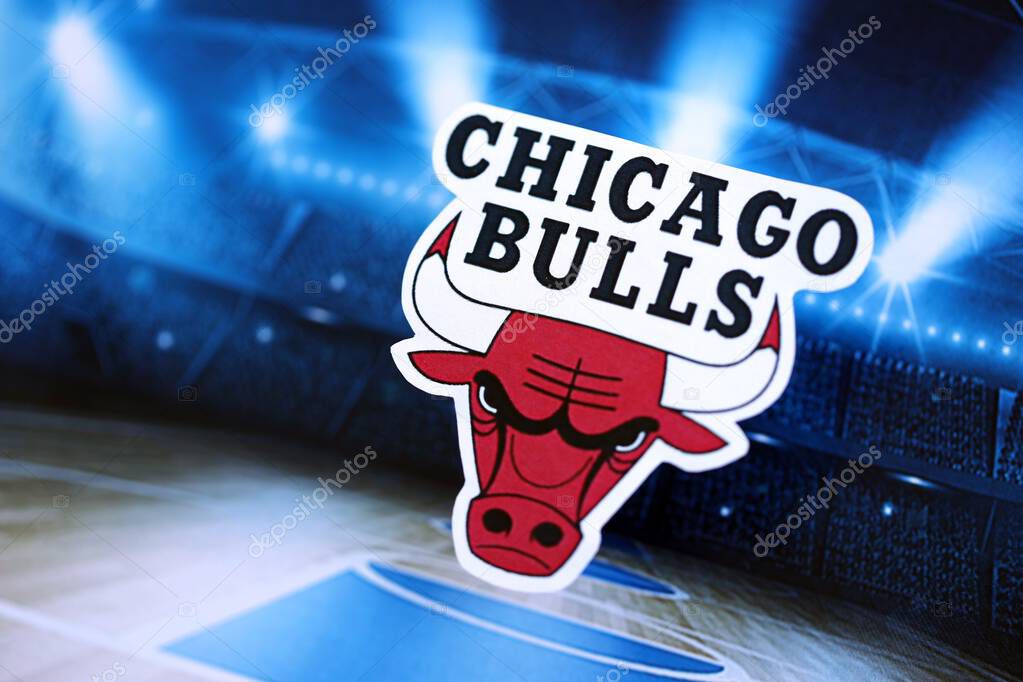 KYIV, UKRAINE - FEBRUARY 23, 2025 Chicago Bulls basketball team badge lies on basketball stadium background banner