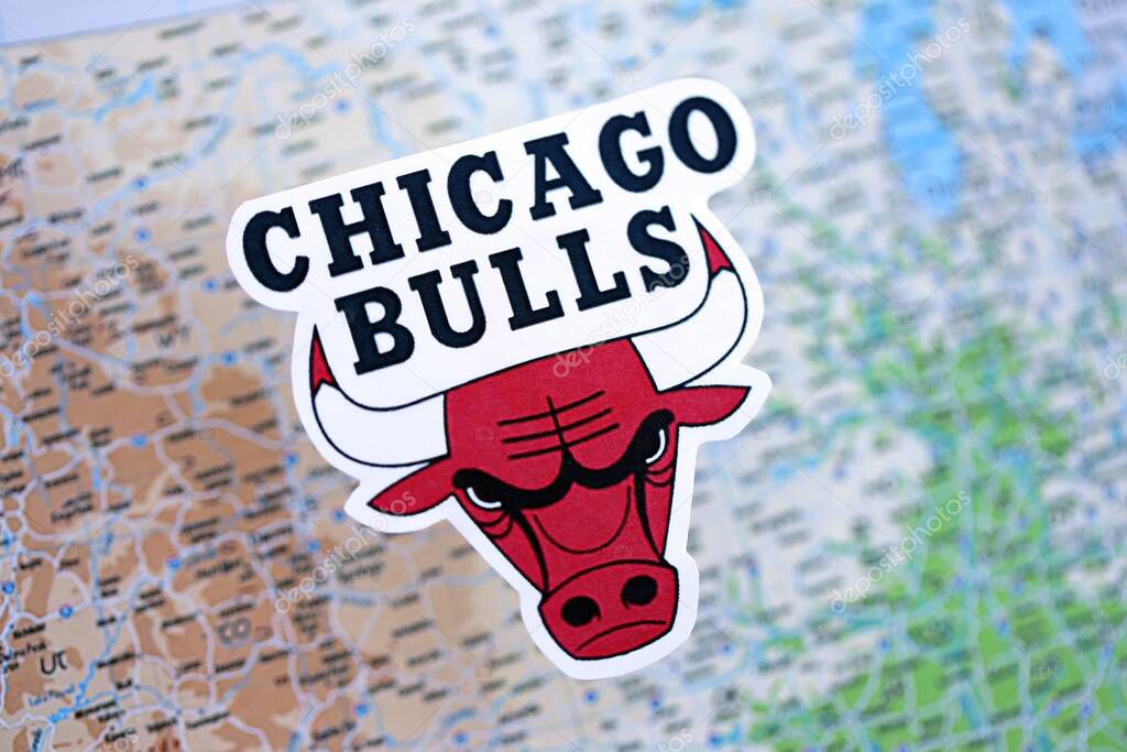 KYIV, UKRAINE - FEBRUARY 23, 2025 Chicago Bulls basketball team badge lies on USA map background banner