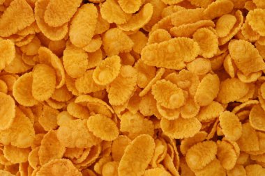 Mısır gevreği arkaplanı ve dokuyu kapatır. Sabah kahvaltısı için mısır gevreği kutusu.