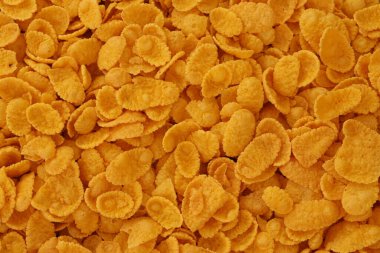 Mısır gevreği arkaplanı ve dokuyu kapatır. Sabah kahvaltısı için mısır gevreği kutusu.