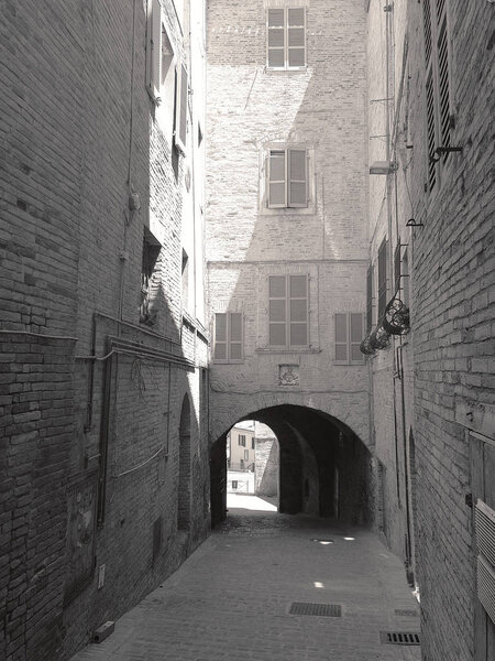 Little alleys and archways in the medieval center of Recanati, Italy
