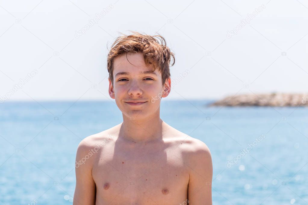 Boy relaxing on a beach in French Riviera