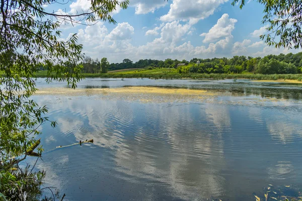 an attractive lake on the outskirts of the village, a convenient place for fishing and outdoor recreation