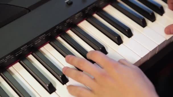 Mens Hands Playing Black Synthesizer — Stock Video