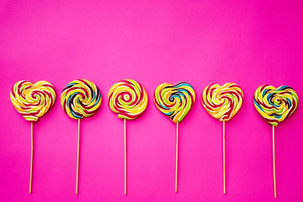 Multicolored Different Sweets Lollipops Pink Background Copy Space Top View — Stock Photo, Image