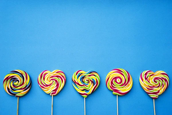 Colored Different Sweets Lollipops Blue Background Copy Space Top View — Stock Photo, Image