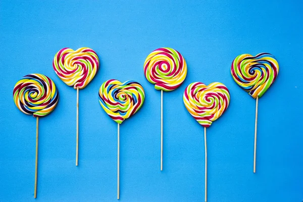 Colored Different Sweets Lollipops Blue Background Copy Space Top View — Stock Photo, Image