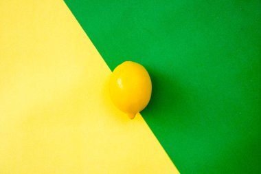 Yellow lemons on yellow green pastel background, concepts,summer ideas of fruit, vegetable, healthy eating lifestyle, flat lay