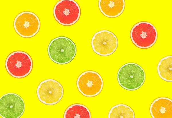 Top View Colorful Orange Yellow Green Fruit Yellow Pastel Background — стоковое фото