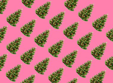 Christmas composition. Pattern made of Christmas tree branches on pastel pink background. Christmas, winter, new year concept. Flat lay, top view, square